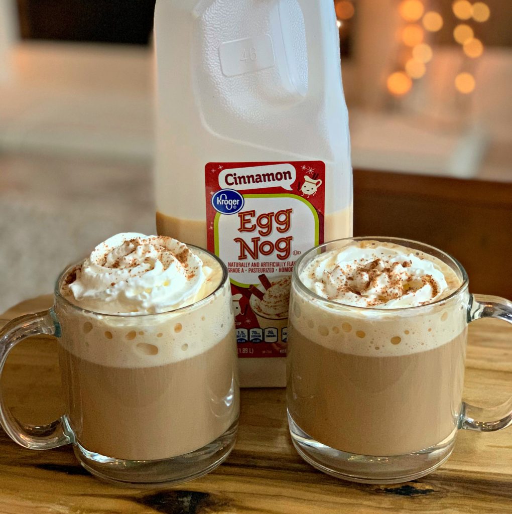 cinnamon eggnog poured into coffee and topped with whipped cream