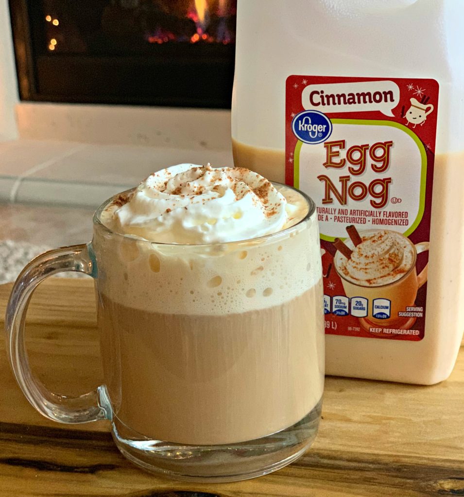 cinnamon spiced eggnog flavoring a cup of coffee with whipped cream on top