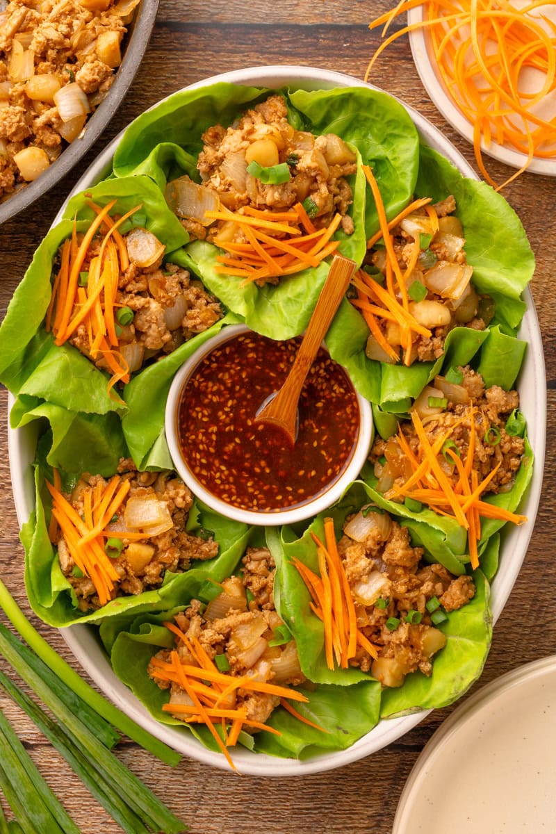 a serving tray full of lettuce wraps ready to eat.