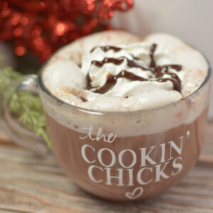 rumchata filled hot chocolate in a glass mug.