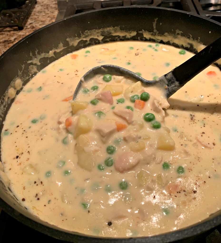 a flavorful cream soup with chicken and veggies