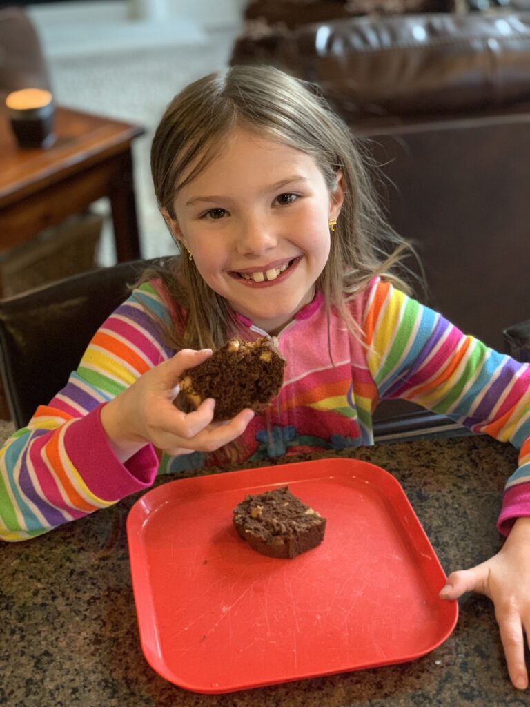 Lindsey eating chocolate peanut butter quick bread