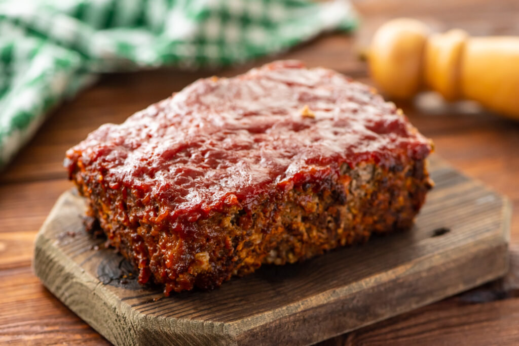 ground beef combined with ingredients to make mom's classic meatloaf