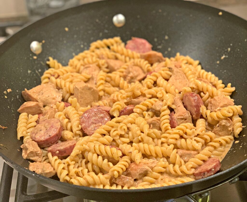 tender pasta coated in a cajun sauce with bits of chicken and sausage throughout
