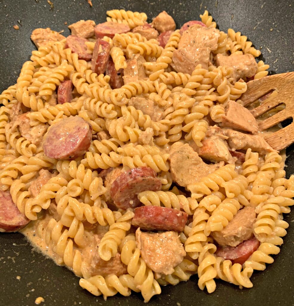 creamy cajun sauce over diced chicken, sausage, and pasta