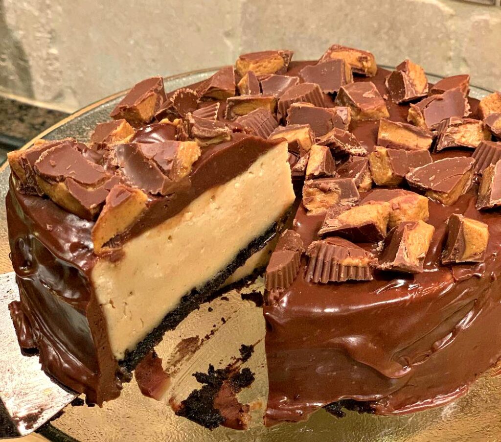 creamy peanut butter cheesecake on an Oreo crust with a chocolate coating