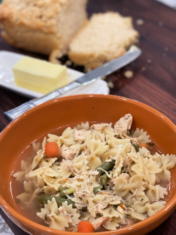 tender noodles, shredded chicken, and vegetables in a savory broth