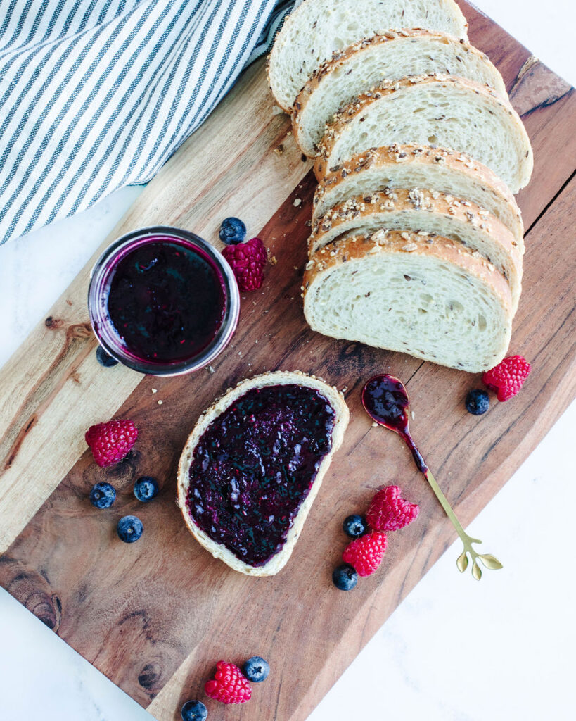 jelly spread onto slices of sourdough toast.