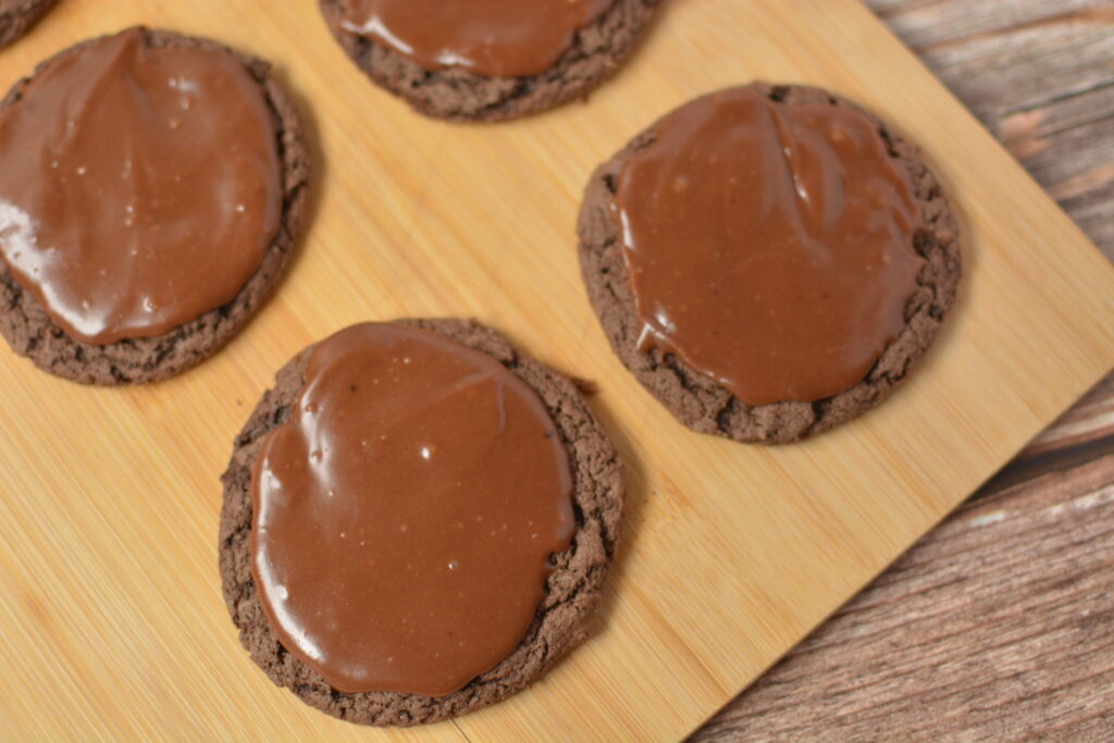 homemade chocolate fudge frosting coating chocolate cake cookies.