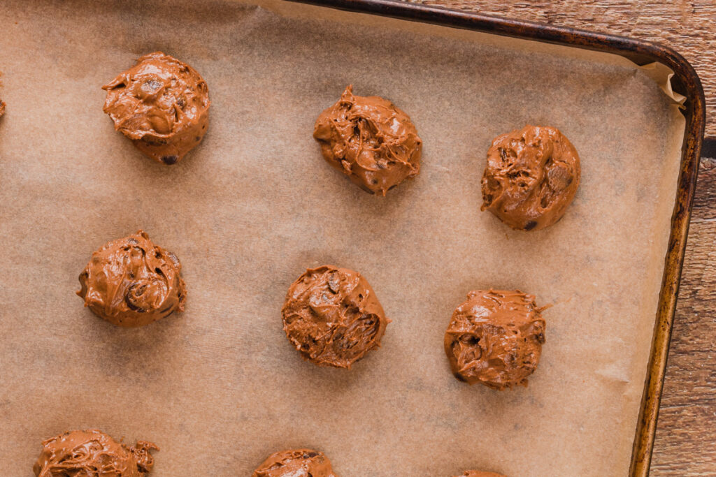 a baking sheet with cookie dough 