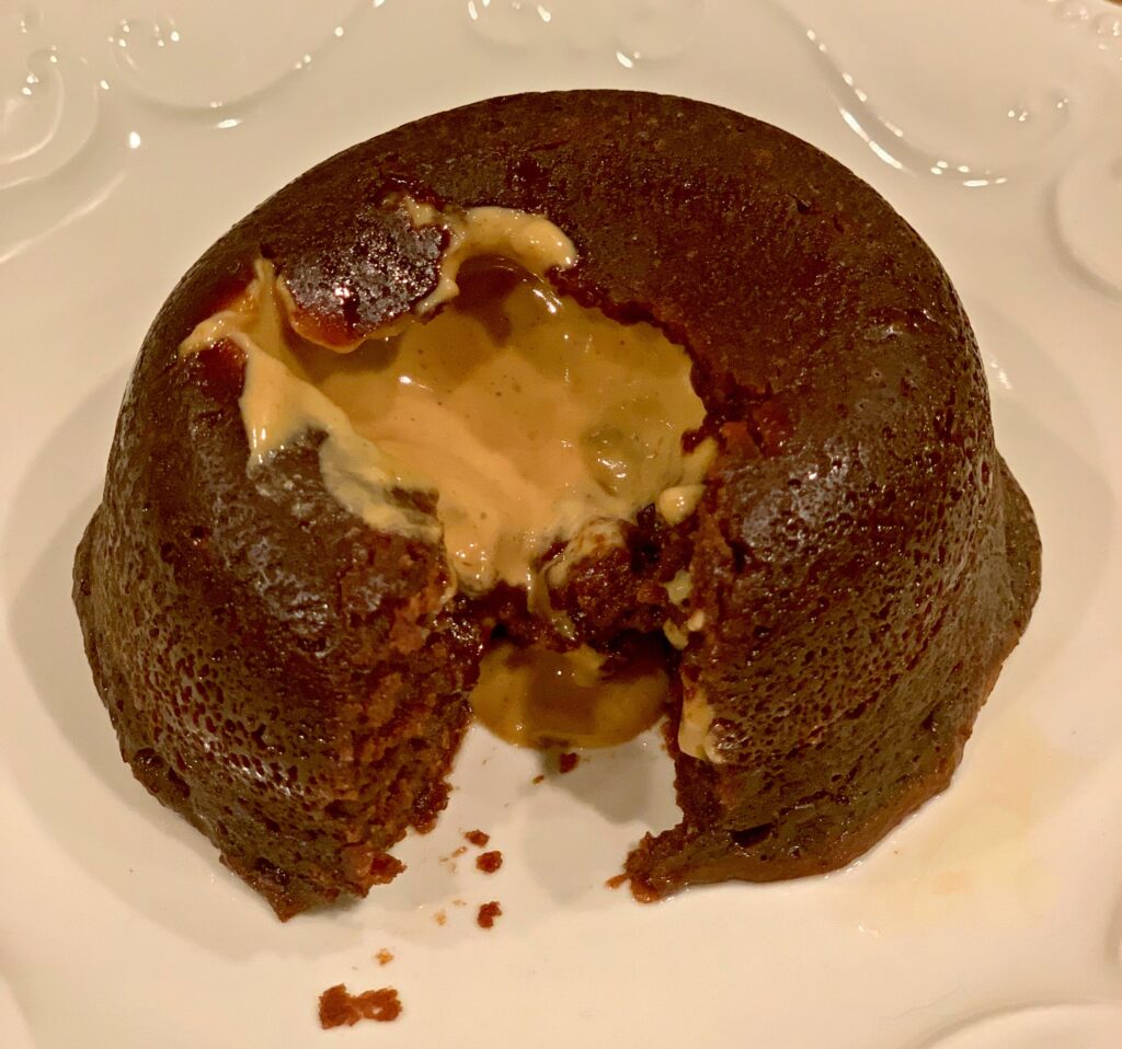 melted peanut butter oozing out of a moist chocolate lava cake