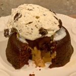 chocolate peanut butter lava cakes with ice cream scooped on top