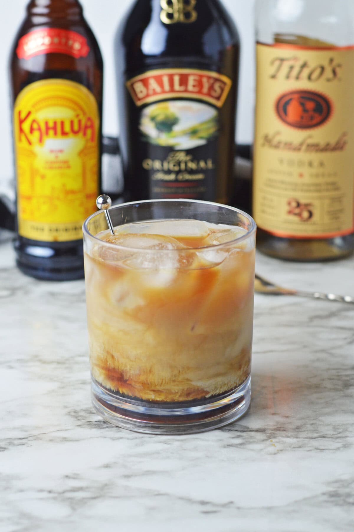 a freshly poured White Russian over ice ready to serve.