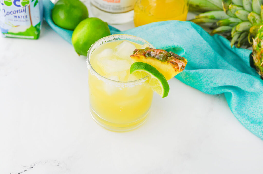 a refreshing margarita with a salt rim and tropical twist.
