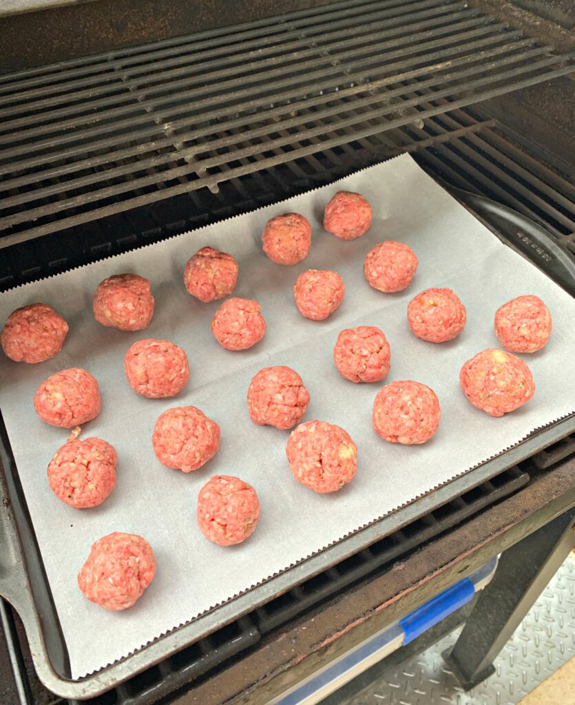 Italian meatballs rolled and prepared for the smoker