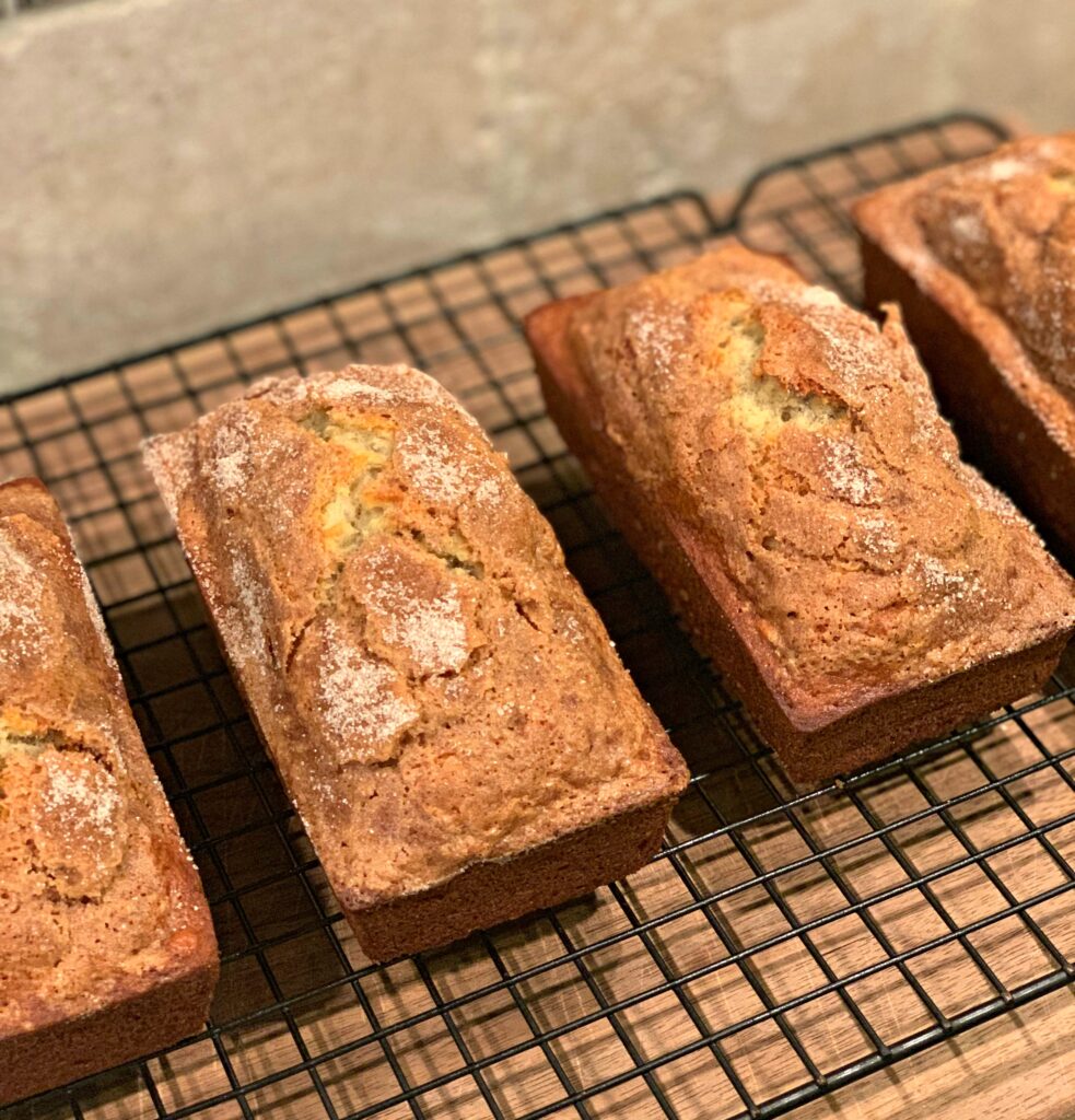 mini loaves of banana bread with cinnamon sugar sprinkled on top and throughout the batter