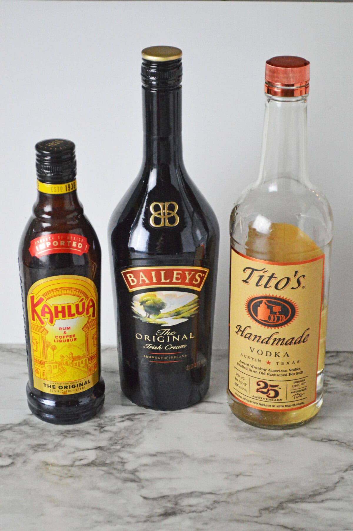all the ingredients needed to make a classic White Russian cocktail.