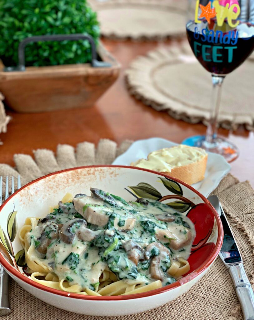 tender chicken and spinach tossed in a garlic parmesan cream sauce