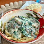 a creamy garlic parmesan sauce coating tender chicken and spinach, cooked in the instant pot