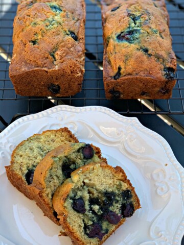 moist, flavorful banana bread with added blueberries throughout
