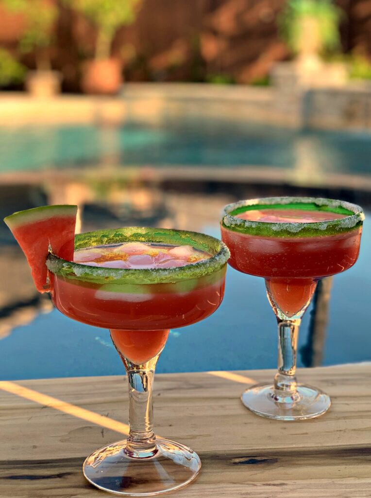 perfectly sweetened margaritas using watermelon juice, triple sec, tequila, and lime juice