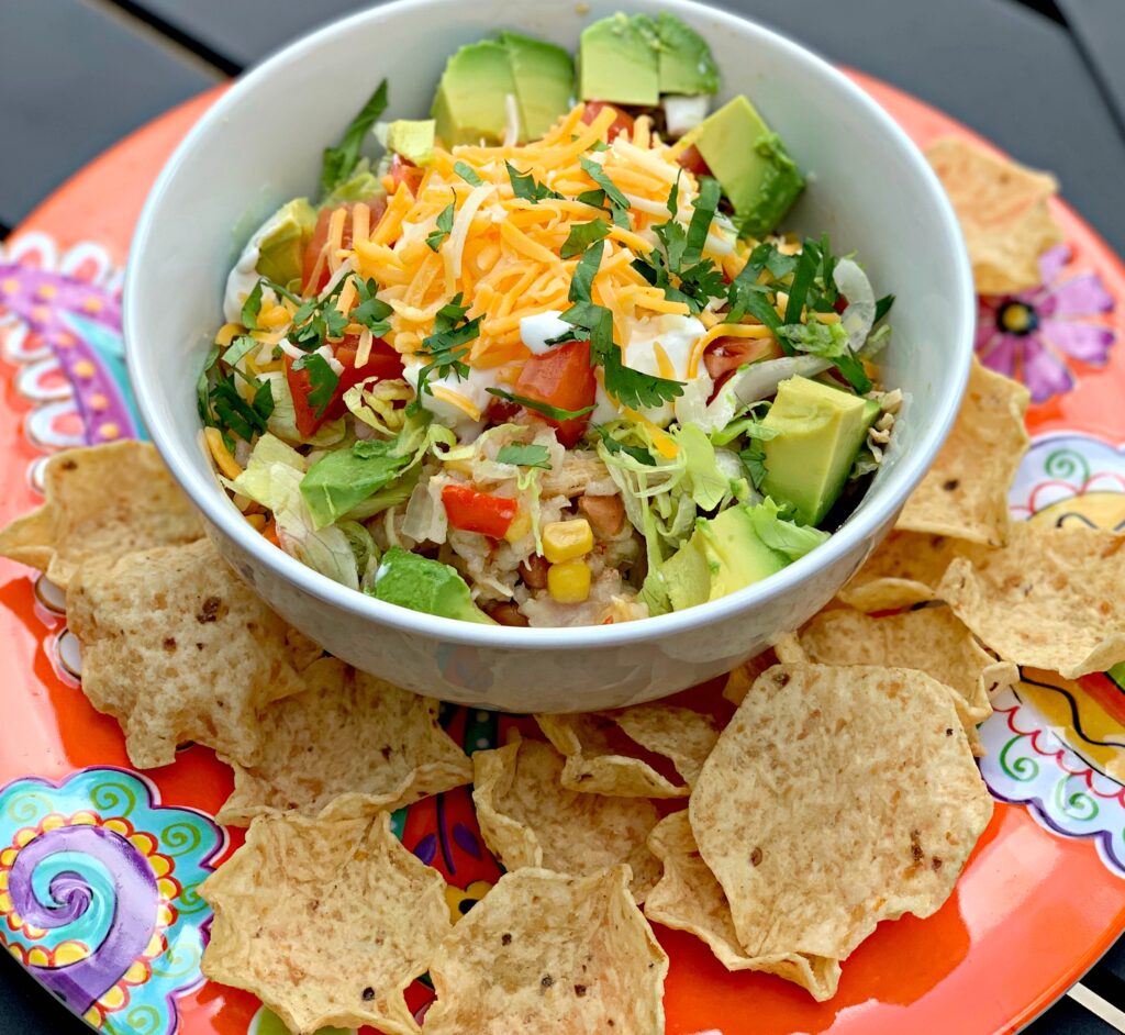 flavorful shredded chicken, beans, and corn combined into a burrito bowl