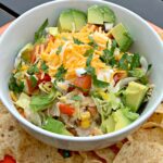 tender chicken, rice, beans, and corn cooked in the instant pot to create burrito bowls