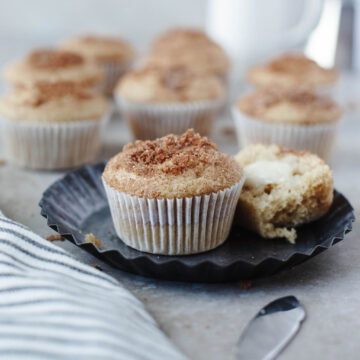 Stack of cinnamon sugar breakfast muffins on a plate.