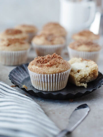 Stack of cinnamon sugar breakfast muffins on a plate.