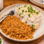 creamy, juicy chicken baked with Caesar dressing on top