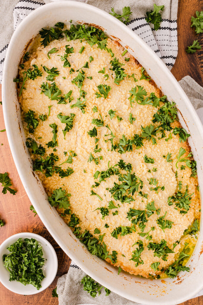 baked Caesar chicken in a baking pan