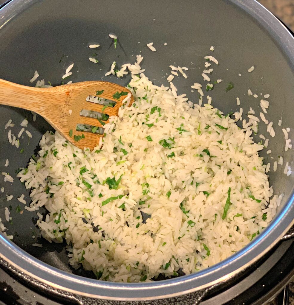 fluffy white rice cooked in the instant pot and cilantro lime mixed throughout