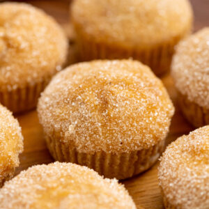 cinnamon sugar coated muffins with apple chunks throughout