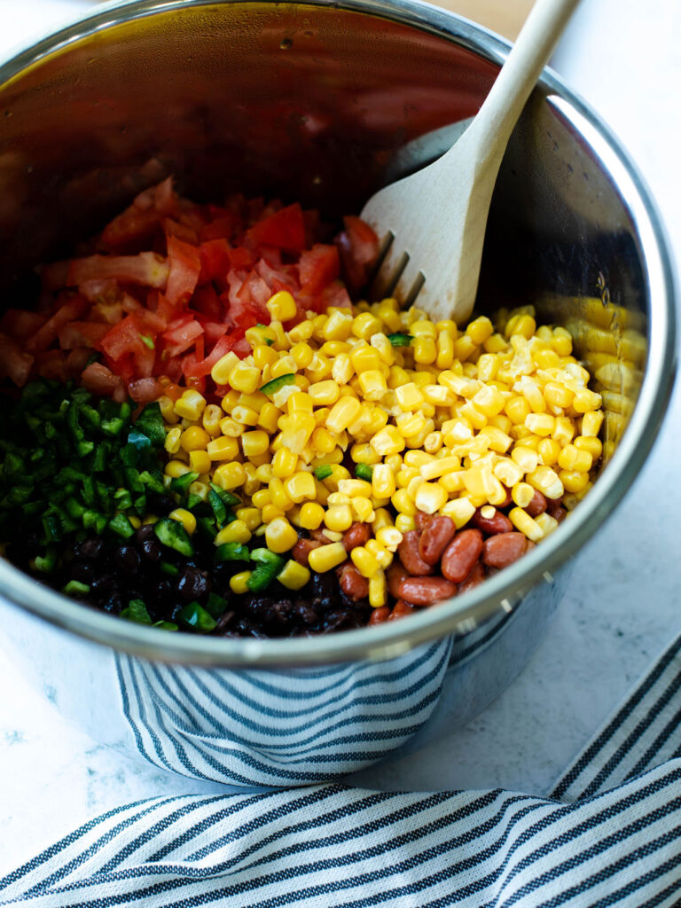 corn, tomatoes, and jalapenos added to the instant pot.