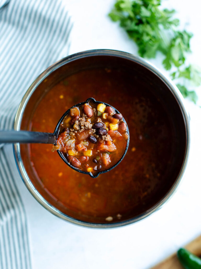 a serving spoon of instant pot taco soup.