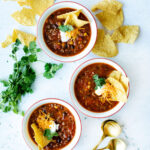 a hearty soup made entirely in the instant pot and served in white bowls.
