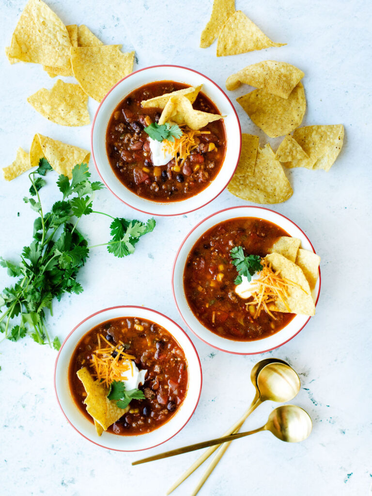 a hearty soup made entirely in the instant pot and served in white bowls.
