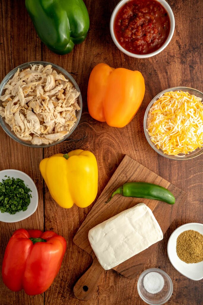 all the ingredients needed to make chicken stuffed peppers.