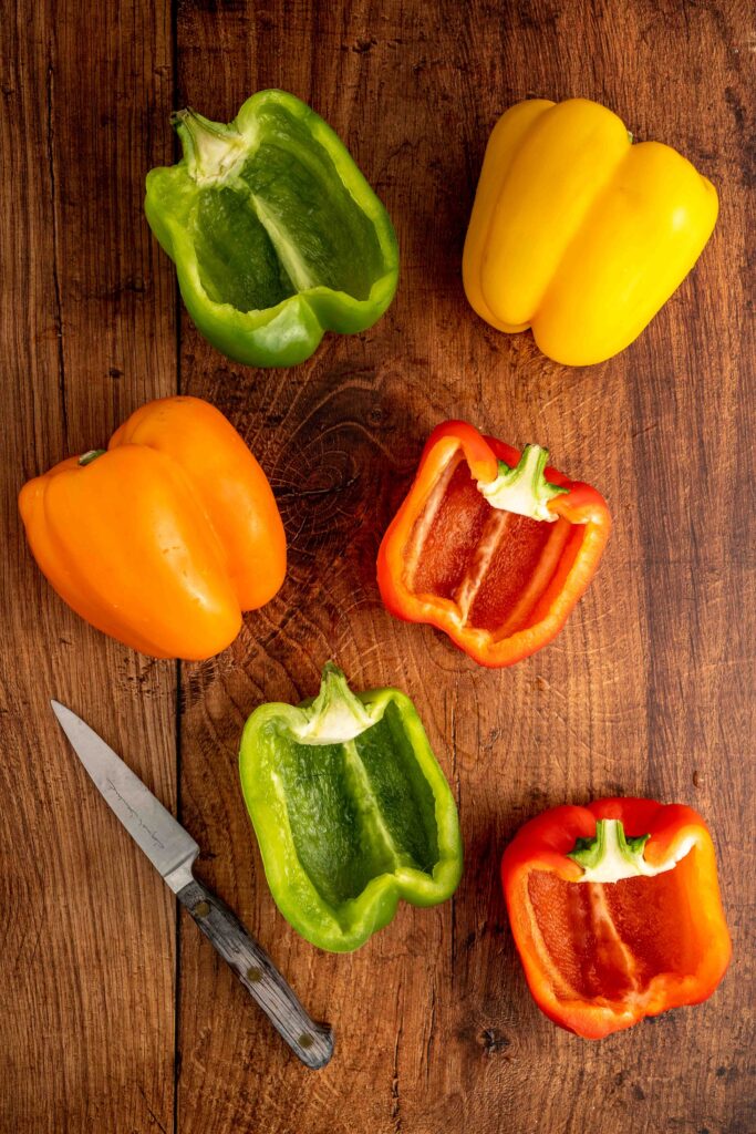 bell peppers sliced in half and hollowed out for cooking.