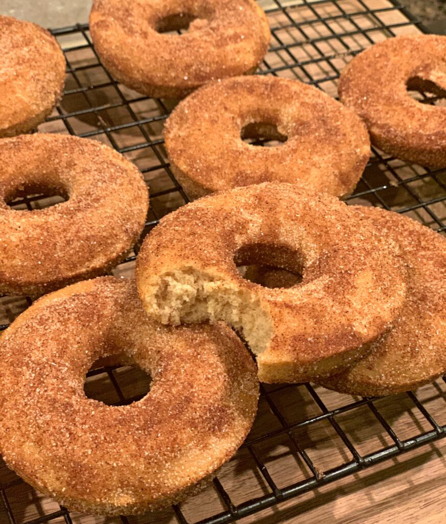 cinnamon sugar coating on a baked apple cider donut