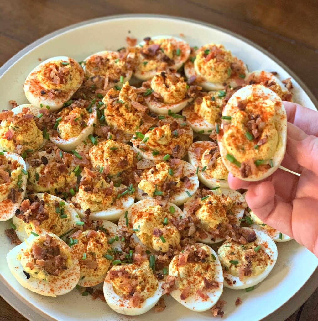deviled eggs that have been smoked and topped with bacon