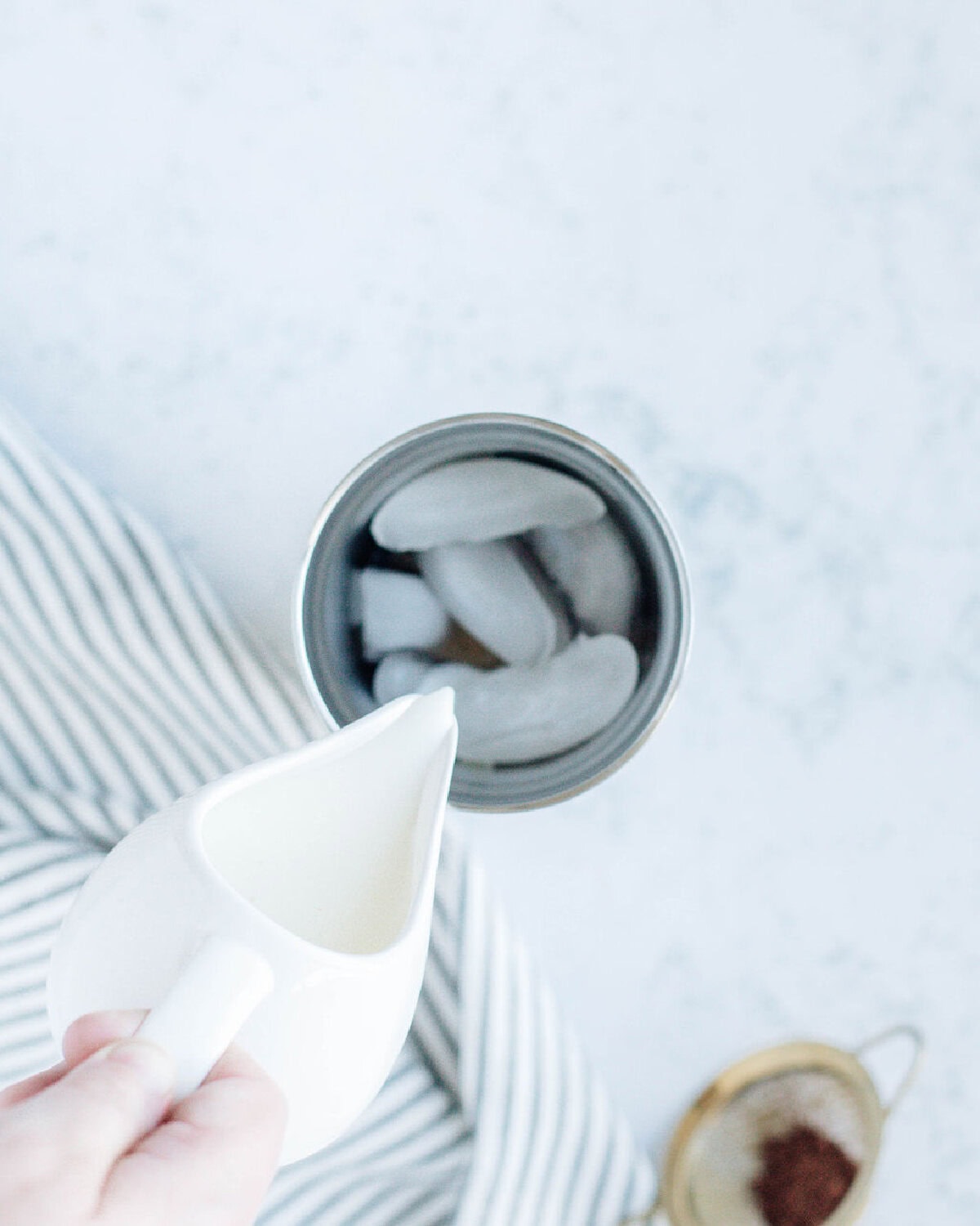 half and half poured into a cocktail shaker.