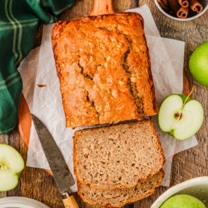 an aerial look at a loaf of bread that has apple and cinnamon throughout.