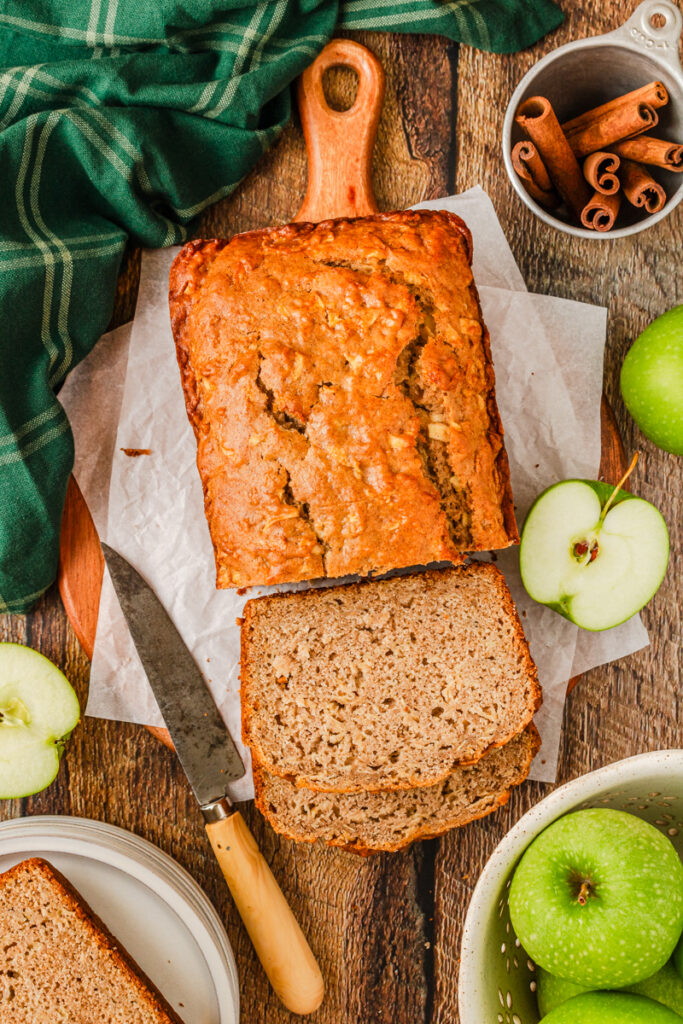an aerial look at a loaf of bread that has apple and cinnamon throughout.