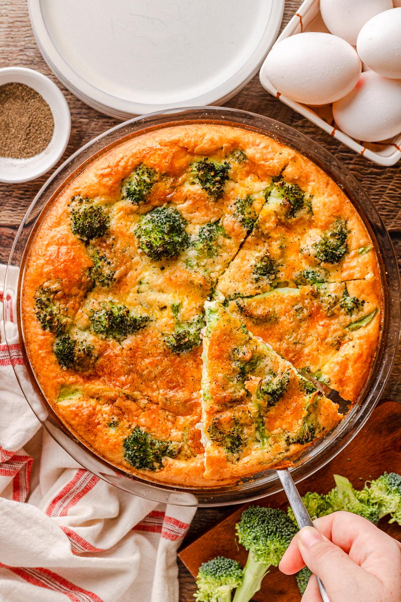 crustless ham and cheese quiche in a glass pie pan.