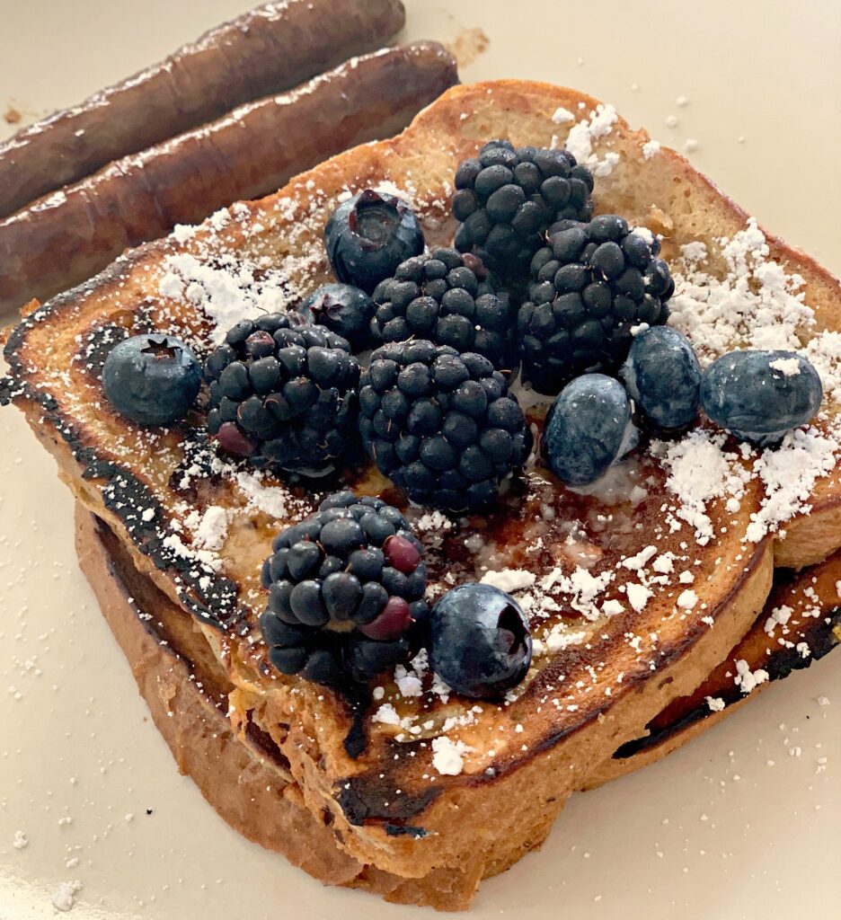 Easy French Toast topped with powdered sugar and fresh blackberries