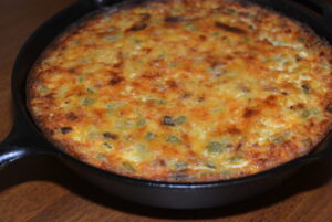 loaded cornbread cooked in a cast iron skillet