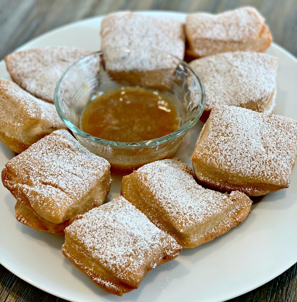 apple beignets made with cider and sprinkled with powdered sugar