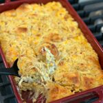 Shredded chicken, bacon bits, biscuit pieces, and cheese combined into a casserole