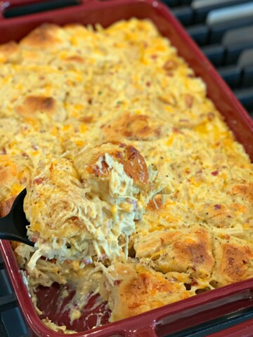 Shredded chicken, bacon bits, biscuit pieces, and cheese combined into a casserole